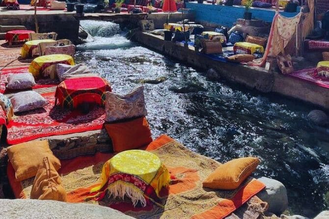 Traditional Moroccan meal served at a riverside restaurant in Ourika.