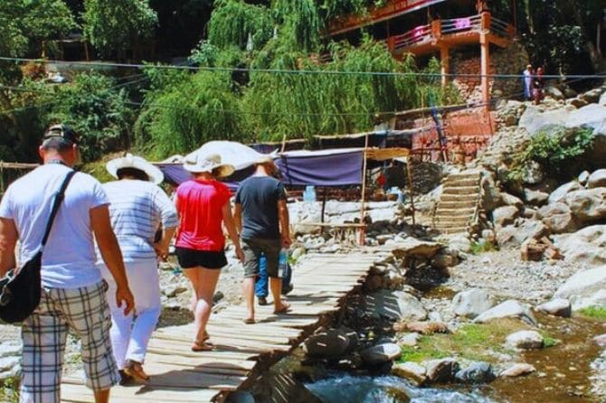 Tourists hiking towards the Ourika waterfalls in Setti Fatma.