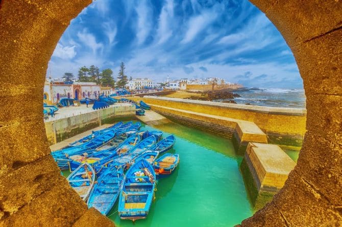 Traditional blue fishing boats docked at Essaouira’s harbor.