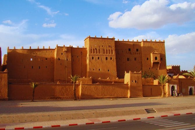 The majestic Kasbah Taourirt with its tall earthen walls and intricate carvings.